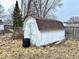 A backyard shed with white painted wood and a fenced in yard at 2513 W 10Th St, Muncie, IN 47302