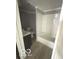 This bathroom has a tub shower combo, toilet, vanity with sink, and modern grey paint at 2526 Eastern Ave, Indianapolis, IN 46218
