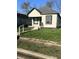 Inviting one-story home with classic design elements and a neatly kept lawn at 2526 Eastern Ave, Indianapolis, IN 46218