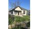 Classic single-story house featuring a covered front porch and tidy front yard at 2526 Eastern Ave, Indianapolis, IN 46218