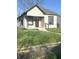 Charming single-story home with a covered front porch and well-maintained lawn at 2526 Eastern Ave, Indianapolis, IN 46218