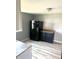 Modern kitchen with black appliances and light-colored laminate flooring at 2526 Eastern Ave, Indianapolis, IN 46218