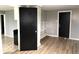 A bright room with new flooring and neutral paint and built in shelving at 2526 Eastern Ave, Indianapolis, IN 46218