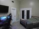 Comfortable bedroom with a desk, television, and ample space for relaxation and entertainment at 2528 Carrollton Ave, Indianapolis, IN 46205