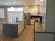 Bright kitchen with island, stainless appliances, quartz countertops, and white cabinetry at 2528 Carrollton Ave, Indianapolis, IN 46205
