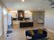 Open-concept kitchen and living area featuring modern appliances, island seating, and stylish decor at 2528 Carrollton Ave, Indianapolis, IN 46205