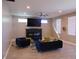 Bright living room featuring modern fireplace, hardwood floors, and trendy blue furniture at 2528 Carrollton Ave, Indianapolis, IN 46205