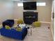 Contemporary living room with stylish blue seating, modern fireplace, and plenty of natural light at 2528 Carrollton Ave, Indianapolis, IN 46205