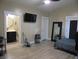 Spacious main bedroom with a walk-in bathroom, TV, and comfortable bed at 2528 Carrollton Ave, Indianapolis, IN 46205