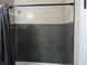 Modern bathroom shower with contrasting light and dark gray ceramic tiling at 2528 Carrollton Ave, Indianapolis, IN 46205