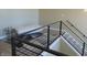 Modern staircase with a geometric carpet and a seating area at 2528 Carrollton Ave, Indianapolis, IN 46205