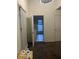 View of doorway leading into tiled room with natural light, overhead light, and closet at 2842 Indianapolis Ave, Indianapolis, IN 46208