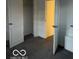This bedroom includes carpeting and an open closet at 2842 Indianapolis Ave, Indianapolis, IN 46208