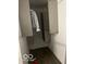 Functional walk-in closet with custom shelving and a hanging rod for storage at 2842 Indianapolis Ave, Indianapolis, IN 46208