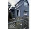 Traditional blue home featuring an awning and fenced yard at 2842 Indianapolis Ave, Indianapolis, IN 46208