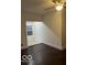 A cozy room featuring wood floors and large opening with natural light at 2842 Indianapolis Ave, Indianapolis, IN 46208