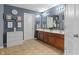 A bathroom features a double sink, two mirrors and a closet at 3322 Paisley Pointe, Whitestown, IN 46075