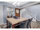 A dining room features a marble table, seating for four, and stairs nearby at 3322 Paisley Pointe, Whitestown, IN 46075