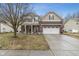 Charming two-story home with a brick and siding exterior, well-manicured lawn, and an attached two-car garage at 3322 Paisley Pointe, Whitestown, IN 46075