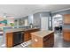 Functional kitchen with stainless steel appliances, wood cabinets, and a center island, perfect for cooking at 3322 Paisley Pointe, Whitestown, IN 46075