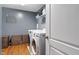 Well-equipped laundry room with modern machines, storage, and practical design at 3322 Paisley Pointe, Whitestown, IN 46075