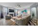 Inviting living room featuring a fireplace, large TV, plush seating, and contemporary decor at 3322 Paisley Pointe, Whitestown, IN 46075