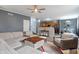 Open-concept living room with a comfortable seating area, seamlessly connected to the kitchen and dining space at 3322 Paisley Pointe, Whitestown, IN 46075