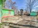View of the backyard featuring a small outbuilding, providing a glimpse of outdoor space for recreation at 3455 Hillside Ave, Indianapolis, IN 46218