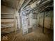 Unfinished basement with exposed ductwork, stone wall and furnace at 3455 Hillside Ave, Indianapolis, IN 46218