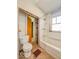 Functional bathroom with standard fixtures, including a toilet, tub, and shower at 3455 Hillside Ave, Indianapolis, IN 46218