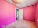 Pink room with a white door and some graffiti; in need of renovations at 3455 Hillside Ave, Indianapolis, IN 46218