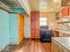 Needs renovation. Includes an electric stove, cabinets, and a window at 3455 Hillside Ave, Indianapolis, IN 46218