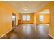 Bright living room with hardwood floors, natural light, and convenient access to the kitchen at 3455 Hillside Ave, Indianapolis, IN 46218