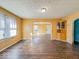 Open living room featuring hardwood floors, sunny windows and an open doorway at 3455 Hillside Ave, Indianapolis, IN 46218