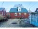 The backyard has a red brick house with a small yard area at 36 Bankers Ln, Indianapolis, IN 46201