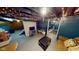 This finished basement space includes a TV, couch, and under-stair storage area at 36 Bankers Ln, Indianapolis, IN 46201