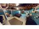 This partially finished basement has string lights, furniture, and room to customize at 36 Bankers Ln, Indianapolis, IN 46201