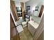 Bathroom with a vanity, toilet, and a window with natural light at 36 Bankers Ln, Indianapolis, IN 46201
