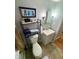 Bathroom featuring a toilet, vanity, and tile floors at 36 Bankers Ln, Indianapolis, IN 46201