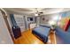Bedroom with a large bed, hardwood floors, and plenty of natural light at 36 Bankers Ln, Indianapolis, IN 46201