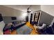 This bedroom features a ceiling fan, gray walls, wood floors, and comfortable seating at 36 Bankers Ln, Indianapolis, IN 46201