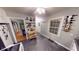 Well-lit kitchen featuring grey floors, white cabinets and appliances, and stylish shelving with decor at 36 Bankers Ln, Indianapolis, IN 46201