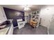 Efficient kitchen featuring white cabinetry, modern appliances, dark accent wall, and functional layout at 36 Bankers Ln, Indianapolis, IN 46201