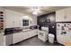 Bright and functional kitchen with white cabinets, contrasting counters, and modern appliances, perfect for cooking at 36 Bankers Ln, Indianapolis, IN 46201