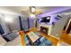 Inviting living room featuring a fireplace, ceiling fan, and hardwood floors at 36 Bankers Ln, Indianapolis, IN 46201