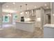 Open-concept kitchen with an island, stainless steel appliances, and hardwood floors at 3604 Maple Ridge Dr, Columbus, IN 47201
