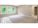 Spacious main bedroom with large windows, a closet, and neutral decor at 3604 Maple Ridge Dr, Columbus, IN 47201