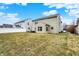 Backyard featuring a spacious grassy area, ideal for outdoor gatherings and recreation at 3844 Kilburn Ct, Indianapolis, IN 46228