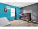 Charming Bedroom with star decals, a crib, and colorful walls at 3844 Kilburn Ct, Indianapolis, IN 46228