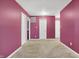 Spacious carpeted bedroom featuring a neutral carpet, white doors and a smooth painted wall at 3844 Kilburn Ct, Indianapolis, IN 46228